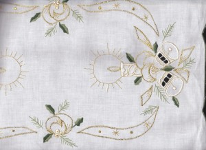 Green & Golden: Beautifully embroidered Candle Light Bells & Holly with gold thread with cutwork details. Pure white cotton for this holiday season. Table topper & Doily & runners available at a budget wise economy.