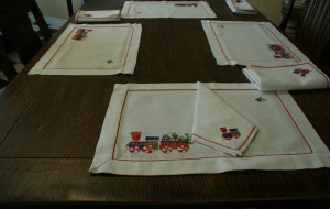 Christmas Train Place Mat & Napkin table sets, cheerful & very affordable to start teaching etiquette & table manners. Set of 4 place mats and 4 napkins. Easy care Viscose & Polyester blend.