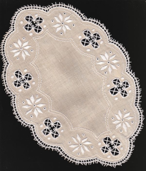 "Picot lace edging on brown Irish Linen doily. Meticulous buttonhole embroidery adds aesthetic charm. Hand-stitched perfection."