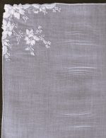 Satin-stitch daffodil handkerchief with tiny embroidered white flowers