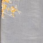 Satin-stitch daffodil handkerchief with tiny embroidered white flowers