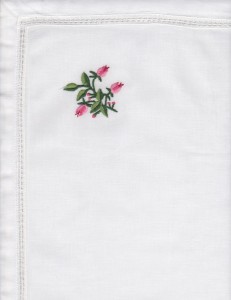 Hemstitched Rose in Rose colour on refreshing crisp white cotton with folded border.