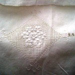 Heirloom Appenzell needle embroidery on Buratto needlework grid pillow cover.