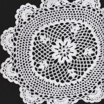 Hand Crocheted doily with Scalloped edging.