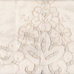 Pure Cotton cutwork rose motif pillow with cutwork trim edge.