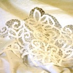 White Battenburg Lace with embroidered accents top sheet.