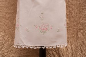 Close up view of the embroidered Dame's Rocket or Mother-of-the-evening pink blossoms.