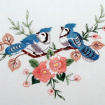 .Tablecloth with two beautiful Blue Jays.