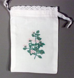 Mayflower- Nova Scotia provincial flower emblem embroidered Lavender Bags with lace trim.