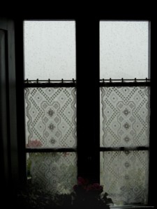 lace-curtains-adorn-the-window-of-a-tuscan-villa-in-the-rain-tuscany-italy.jpg