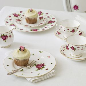 A doily & a coaster is an easy way to add elegance to your priced Royal Albert collection of the "New Country Rose" china pattern.