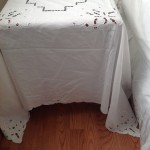 Cutwork Rose Square tablecloth is aother ready made element for that designer's look for the bedside table. 