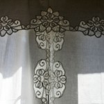 Battenburg Lace Peonies decorated along the full length of this crisp white cotton curtain set...even the tie-backs.