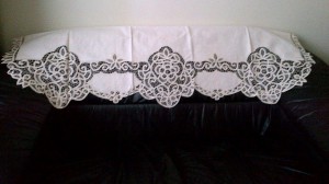 Ecru Battenburg lace Window Pane style valance as a sofa back cover,