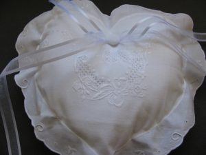 Exquisite Hand stitched Appenzell Embroidery gives this heart shaped cushion an elegant Ring Bearer Pillow