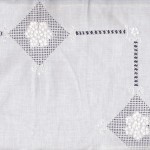 Heirloom Appenzell needle embroidery on Buratto needlework grid pillow cover.