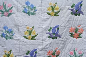 Botanical Garden beautifully applique with accent embroidered flowers.