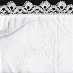 Cluny Lace pillow cover with satin stitched Cascade of Flowers.