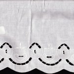 Natural Fibre Cotton Rich Cutwork Embroidery of Tulips all along the edge. White Colour.
