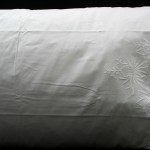 Intense Embroidery of Chrysanthemum and Roses with cutwork & drawn thread details on Natural Fibre Cotton Rich pillow Cases. White colour. Queen size