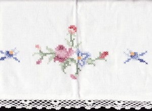 Cross-stitched and fine Crochet Lace trimmed pillow sham