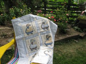 Sun Bonnet Sue or Dutch Girl baby quilt with embroidered 