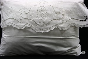 An exquisite Crisp White Cotton rich pillow case in envelope style. Beautiful Cutwork embroidered details with a very fine hand crocheted full lace edge. Standard size only.