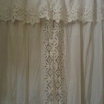 Eyelet Lace Shower curtain is centre part with eyelet lace along the edges.