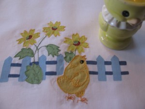 Picket Fence with Contour Embroidered Chicks and Sunflowers guest towels as place mats for Easter family dinner.