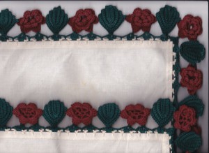 Grandma's handkie with Irish Roses and leaves motifs crocheted lace along the trim edge.