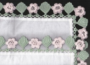 Grandma's handkie with Irish Roses and leaves motifs crocheted lace along the trim edge.