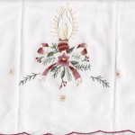 Beautifully embroidered Candlelight with Holly branches & ribbon on white cotton is a budget wise decoration for the entire holiday season