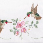 Ruby Throats Huimming birds in embroidered tablecloth