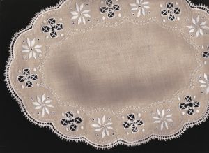 Lefkara Lace style oval tea coaster white embroidery on brown colour Irish Linen.