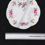 Royal Albert Moss Rose inspired cross-stitched doily- a coaster.