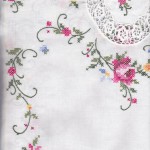 A brilliant rendition of Royal Albert Moss Rose china pattern in cross stitched runner.