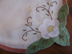 White Applique Narcissus meticulous & evenly stitched place mat. 