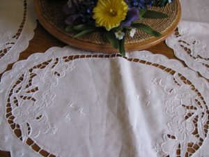 Linen Easter Lily oval place mat an elegant setting for cordial family gathering. 