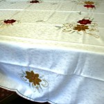 Classic and elegant Red & Gold Poinsettias appliqué on White Embossed fabric is very economically priced.
