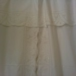 Starburst shower curtain features punch work embroidery. Centre part with tie-backs. Percale Cotton/Polyester blend.