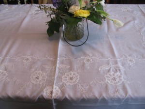 Chrysanthemums embroidered on linen and polyester blend.