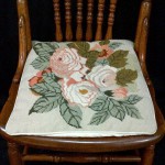 Adam first tea rose woolen needlepoint tapestry as a chair pad.