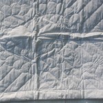 Heirloom quality Wedding quilt with Italian Trapunto Wedding Doves and Irish Claddagh Ring accents. 