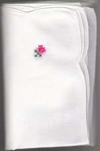 Crisp White Cotton napkins with hand embroidered cross stitches corner.