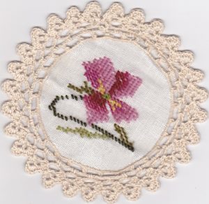 Woolen Needlepoint Gros Point 6 inch tea coaster with crochet trim picoted rosebuds.
