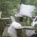 Cluny Lace Euro size cushions is a romantic backdrop for relaxing in cottages or backyard decks.