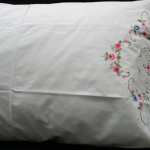 Cross-Stitched hand Embroidered pillow cases with crochet lace full edged and insert on premium crisp white cotton is a cheery way to wake up in the morning.