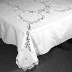 A Touch of Cluny Lace is simple elegance with hand embroidered heart shaped flower accent cotton tablecloth.