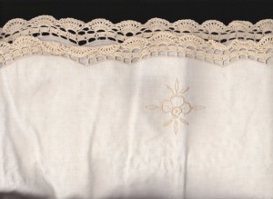 Hand crocheted lace trim on the entire edge of the tablecloth